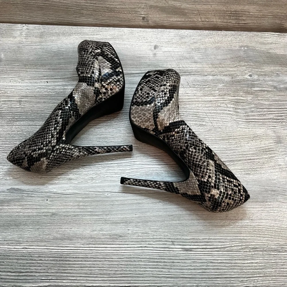 Olsenboye tall platform snakeskin patterned high heels. Closed toe size 9